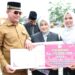 Apresiasi Capaian MTQ Nasional XXXI, Bupati Aceh Utara Ayahwa Serahkan Bonus Sepeda Motor dan Uang Tunai
